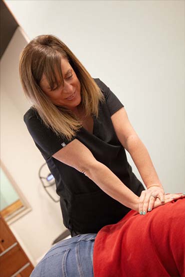 Woman receiving myofascial release on stomach